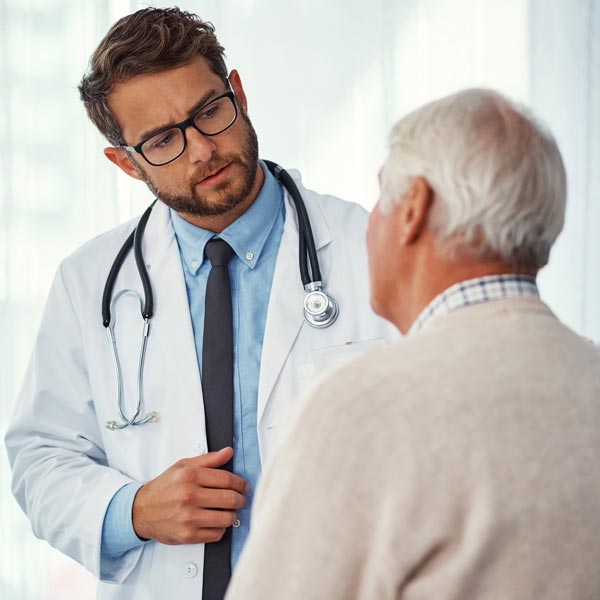 doctor talking to senior man