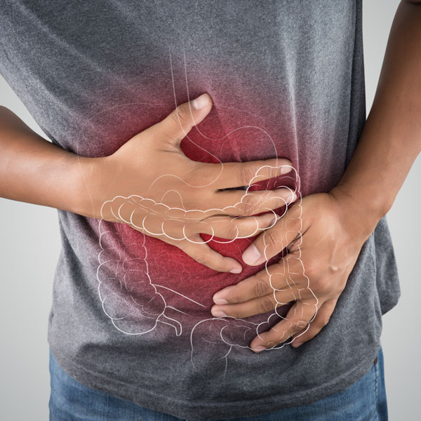 man holding stomach in pain